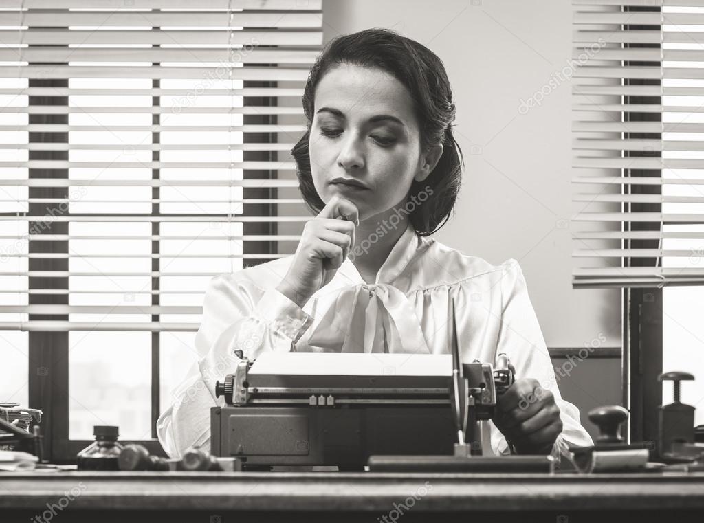 Pensive secretary with typewriter