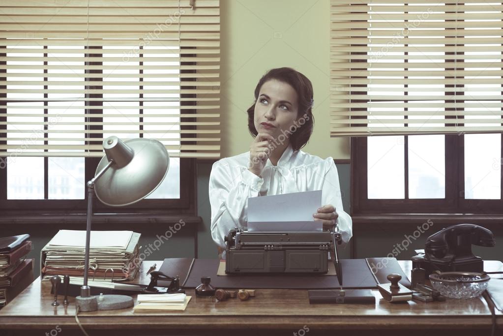 Pensive secretary with typewriter