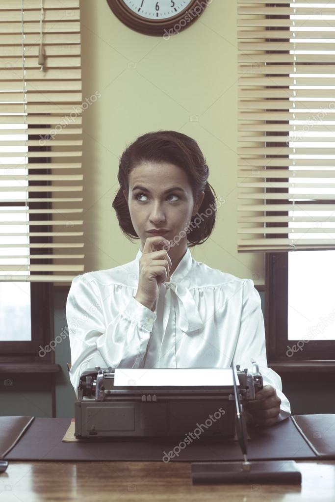 Pensive secretary with typewriter