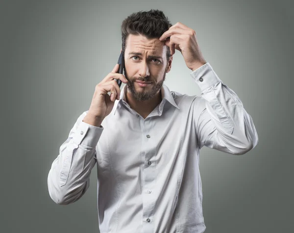 Disappointed man on the phone — Stock Photo, Image