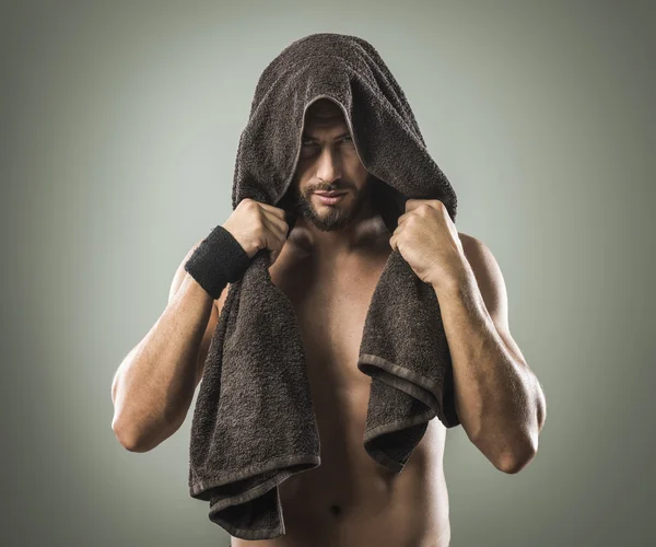 Man covering his head with towel — Stock Photo, Image