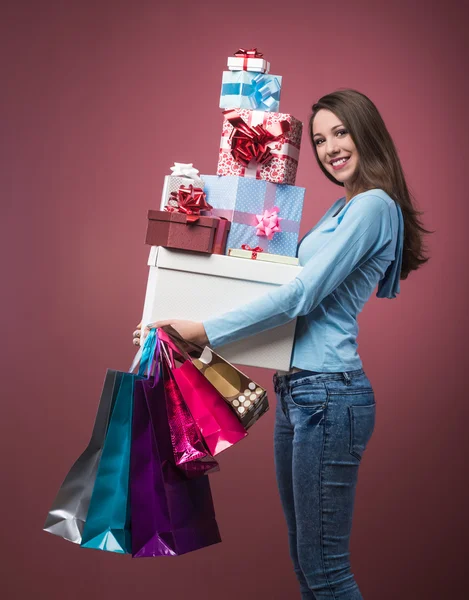 Woman shopping and holding gift boxes — Stock Photo, Image