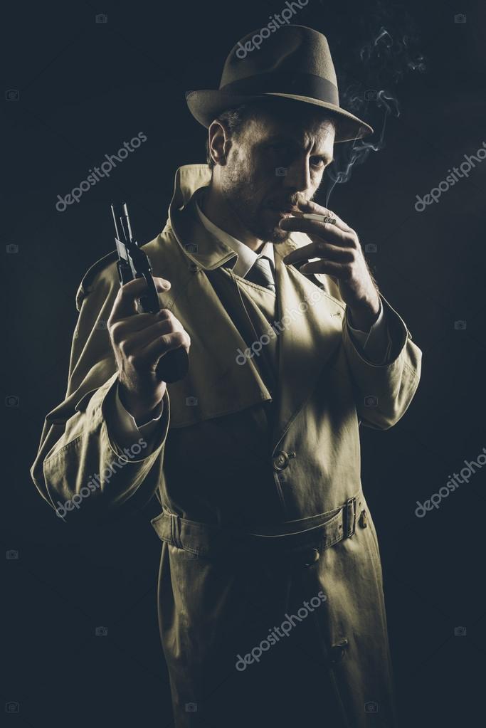 Gangster in trench coat smoking Stock Photo by stokkete 63432169