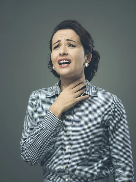 Woman with sore throat touching neck — Stock Photo, Image