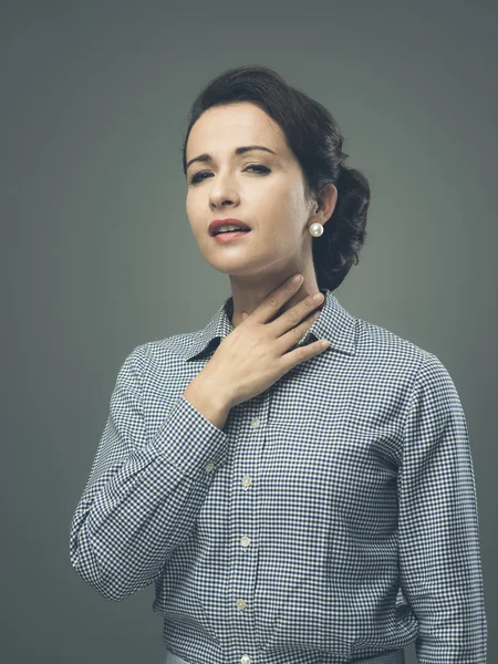 Woman with sore throat touching neck — Stock Photo, Image
