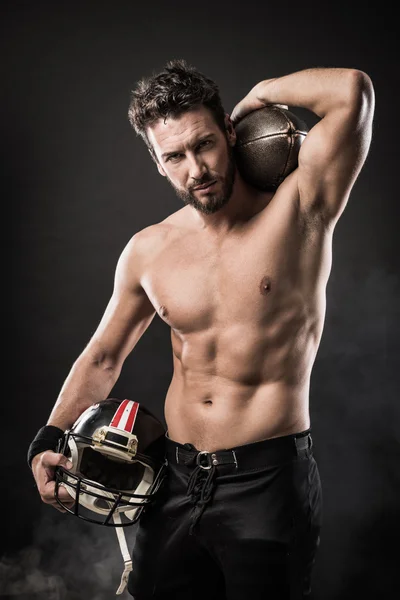 Shirtless football player with helmet — Stock Photo, Image