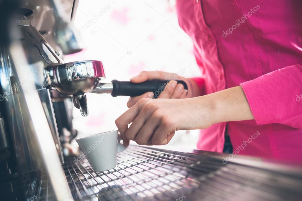Waitress making coffee
