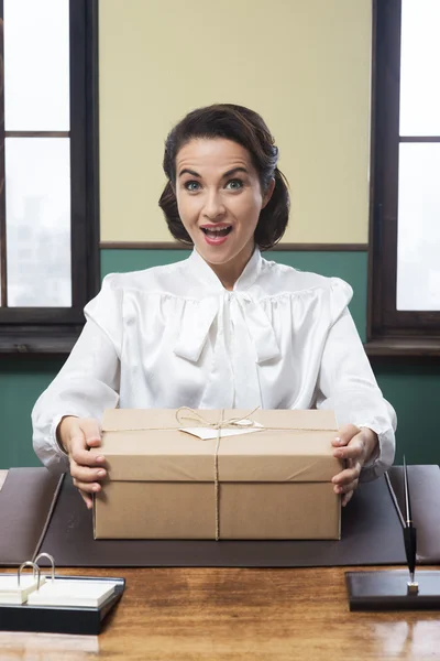 Vintage woman receiving surprise box — Stock Photo, Image