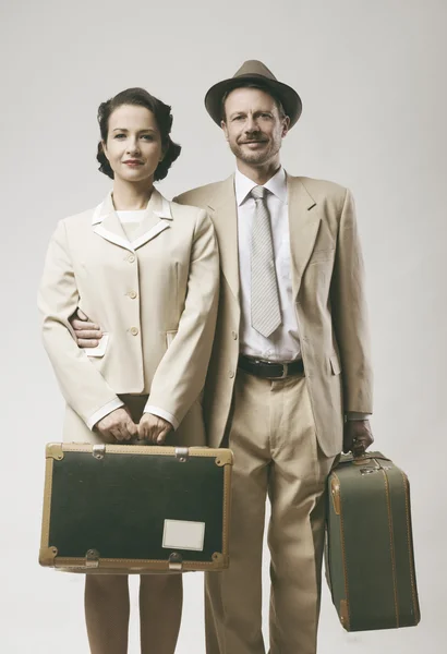 Couple leaving for honeymoon with luggage — Stock Photo, Image