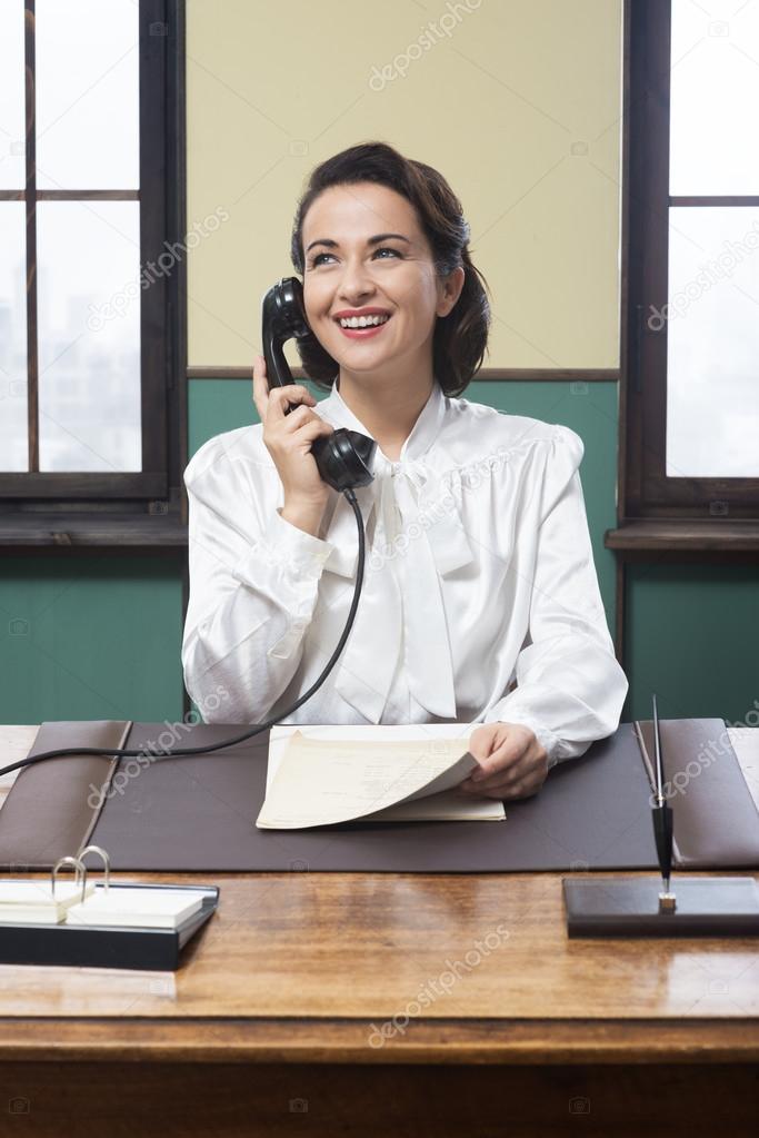 Vintage receptionist working at office desk