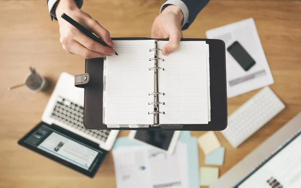 Businessman writing notes — Stock Photo, Image