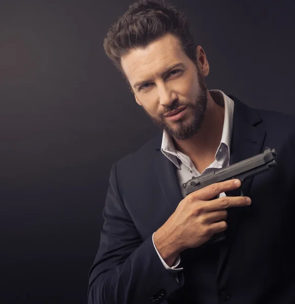 Confident undercover agent with a gun — Stock Photo, Image