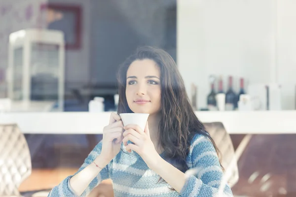 Teenager girl having coffee break Stock Picture