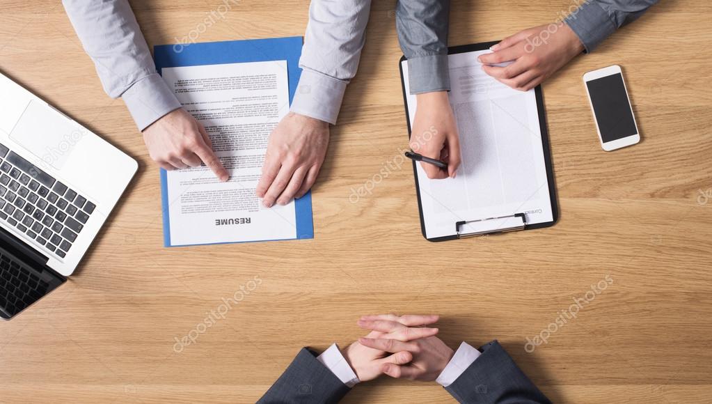 Candidate having job interview with examiner
