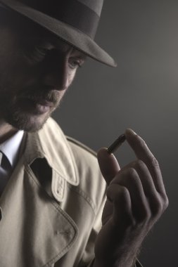detective holding a bullet