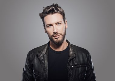 guy in black leather jacket posing