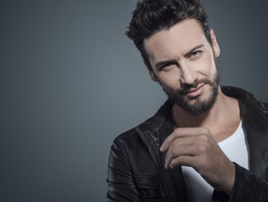 guy in black leather jacket posing