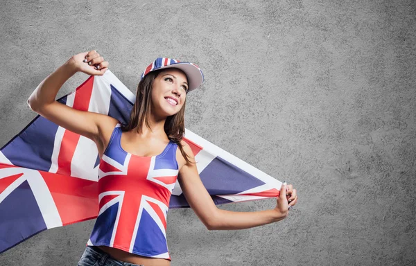 Cheerful English girl holding  a flag — Stock Photo, Image