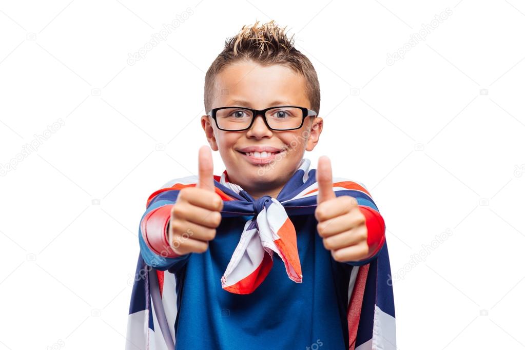 Smiling superhero showing  thumbs up