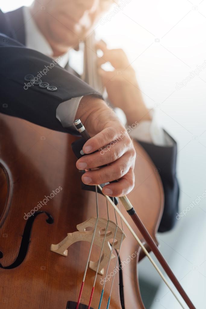 Professional cellist playing cello