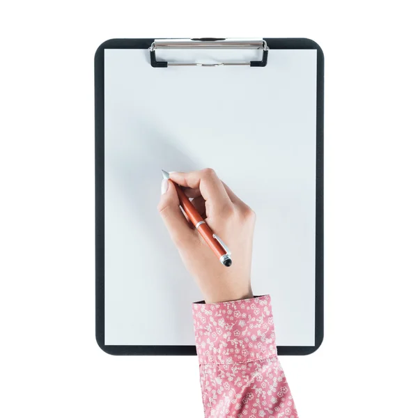 Woman writing on a clipboard — Stock Photo, Image