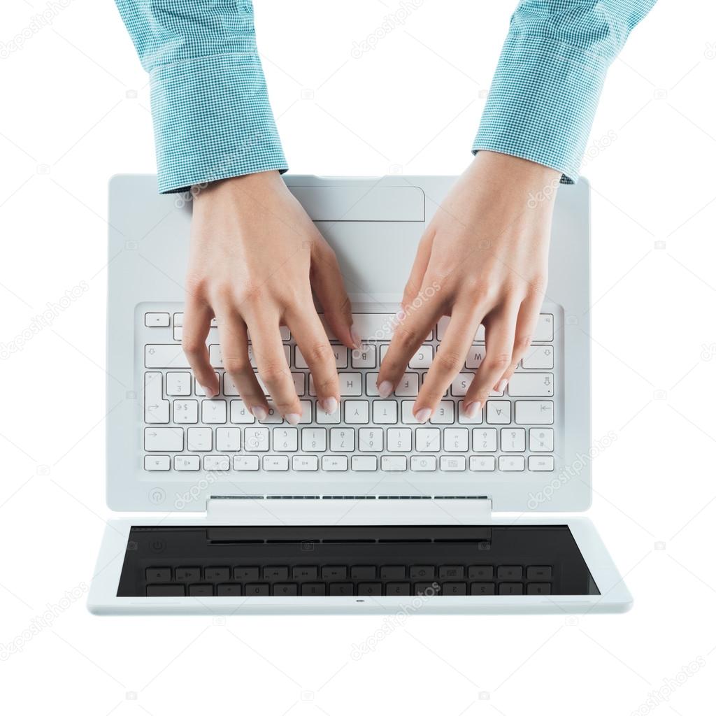 woman typing on a laptop keyboard