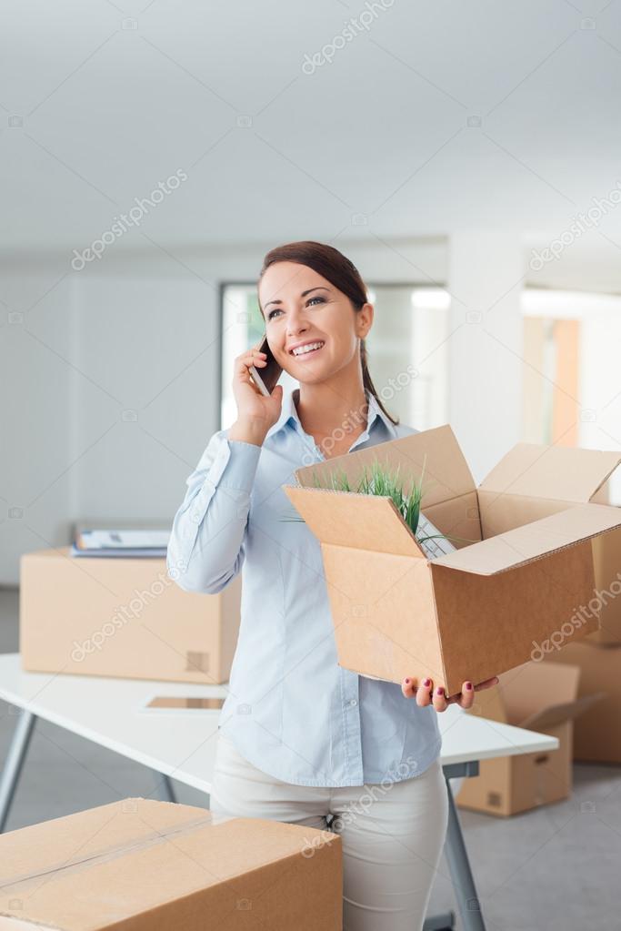 Woman moving in a new office Stock Photo by ©stokkete 88235400