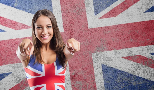 Ragazza sorridente che punta — Foto Stock