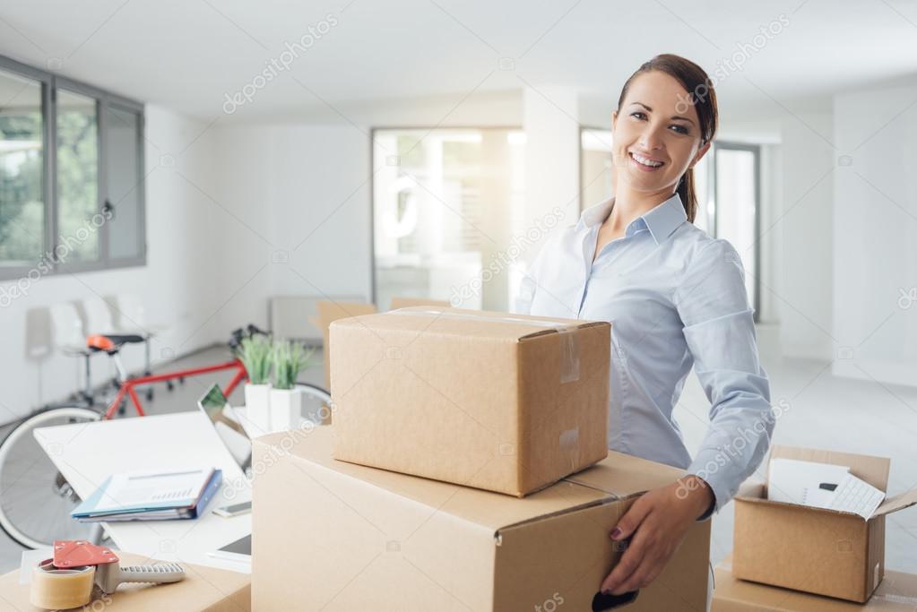 woman carrying boxes