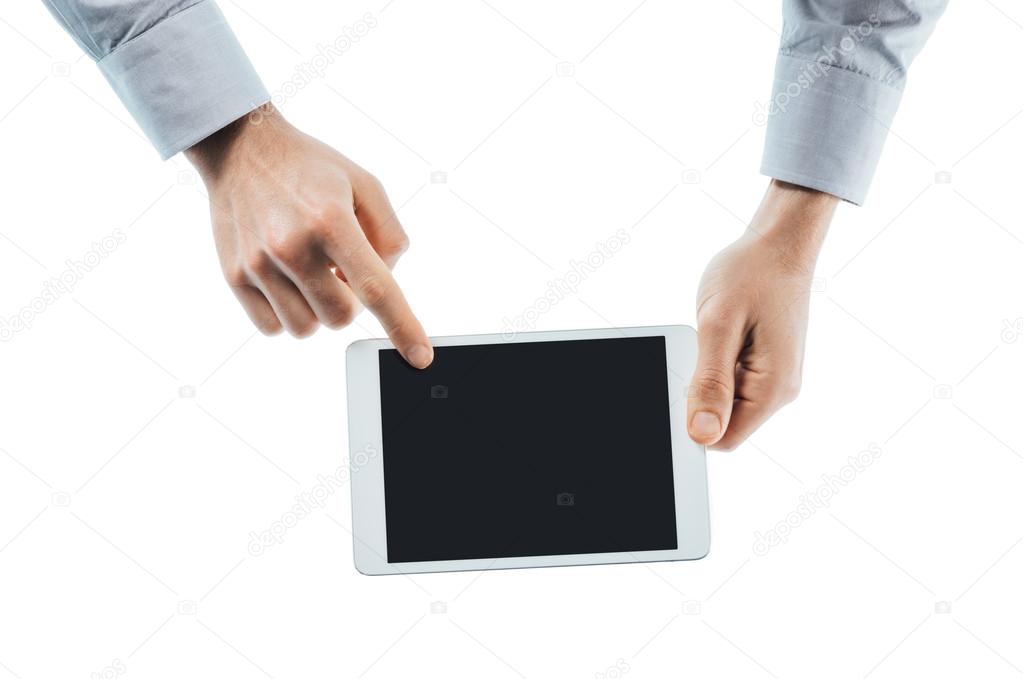 Hands holding a tablet