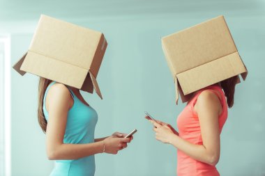 girls with boxes on their heads clipart