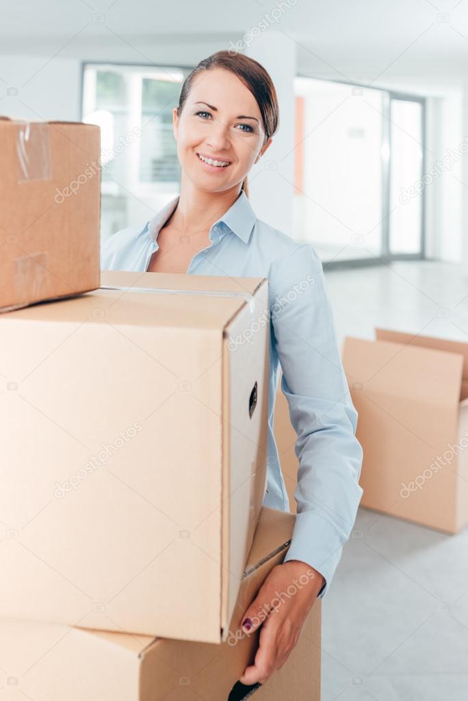 woman carrying carton boxes