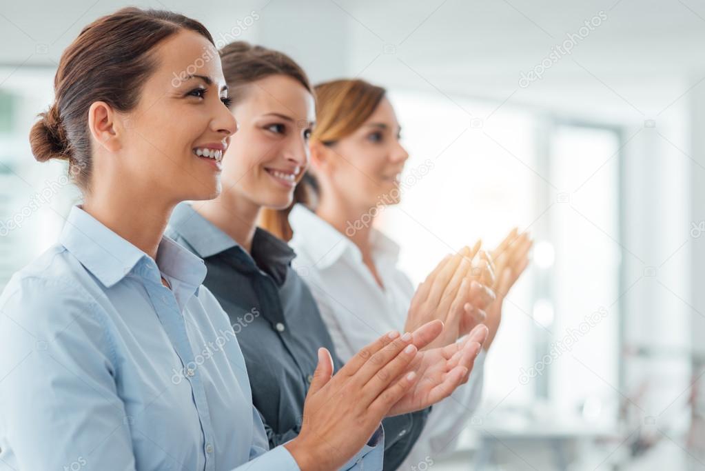 business women applauding