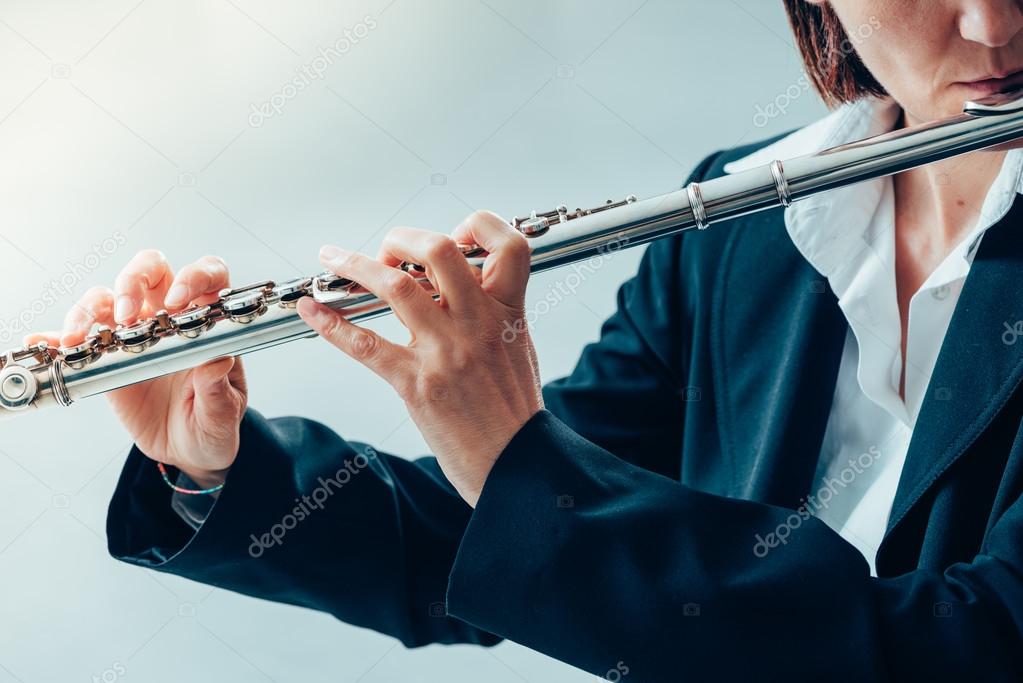 female flutist performing