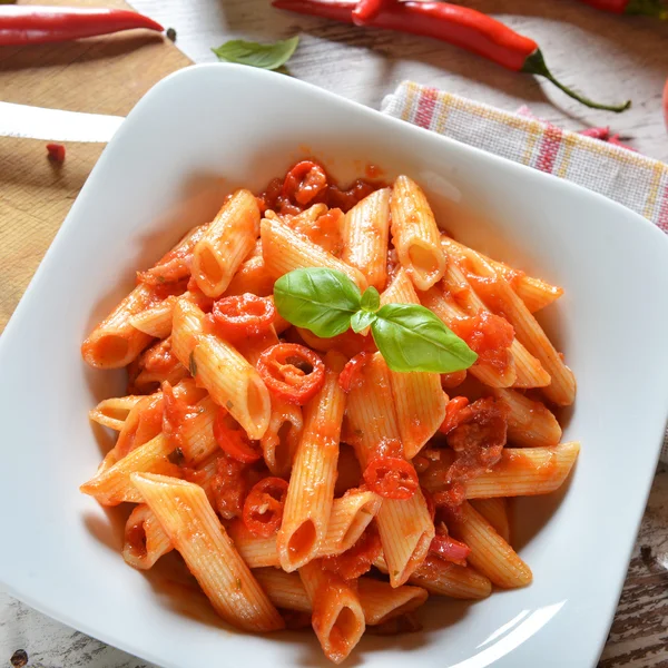 Penne pasta with chili sauce — Stock Photo, Image