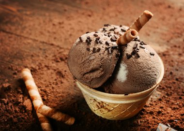 Chocolate ice cream with sweet tubes clipart