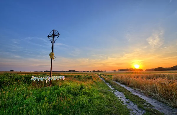 Landscape with sunset and cross — Stock Photo, Image