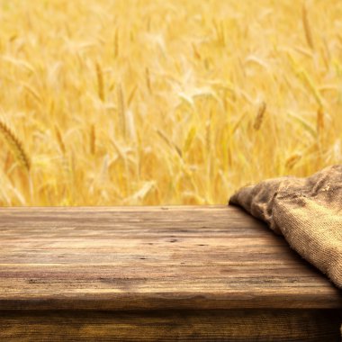 Empty table on wheat field clipart