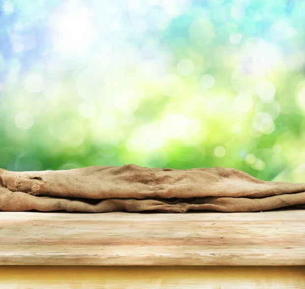 Empty table  with blurred green background — Stock Photo, Image