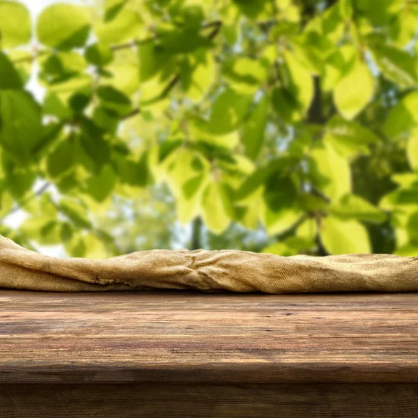 Empty table with green leaves — Stock Photo, Image