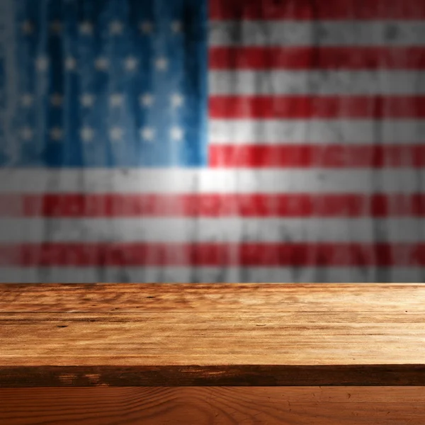 Empty table with american flag — Stock Photo, Image