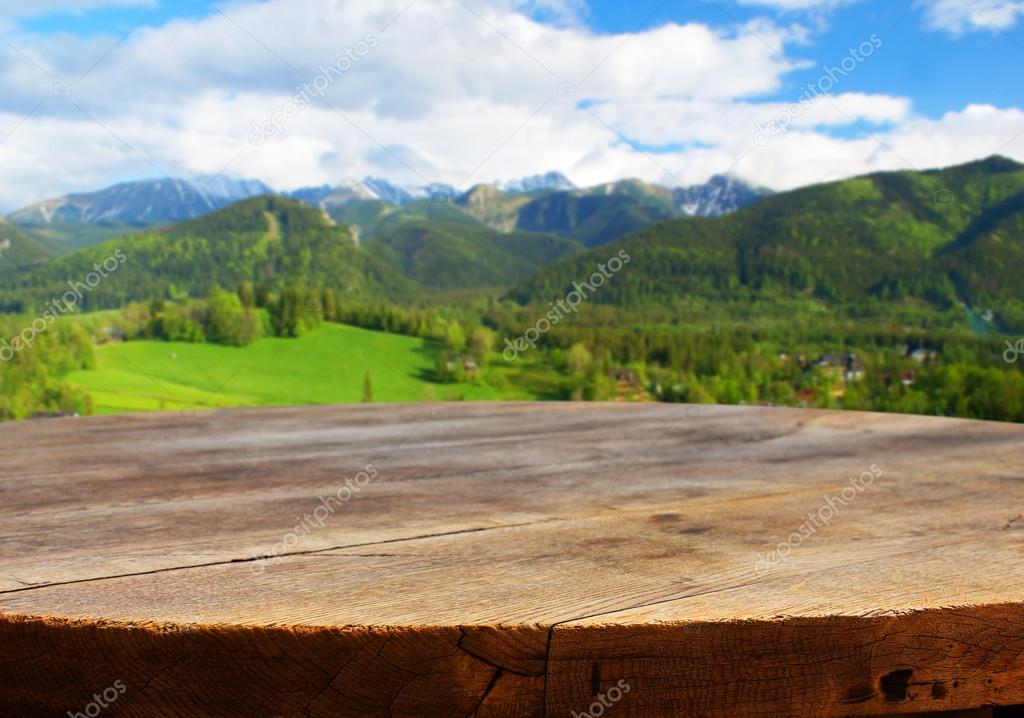 Empty table with mountain background