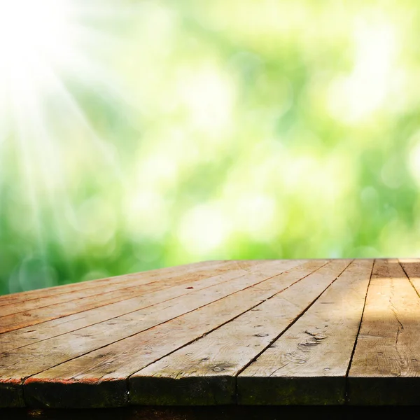 Empty table  with blurred green background — Stock Photo, Image