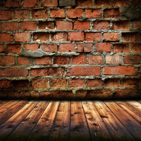 Plancher en bois et mur de briques — Photo