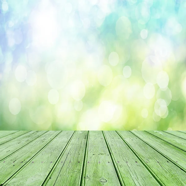 Empty table  with blurred green background — Stock Photo, Image