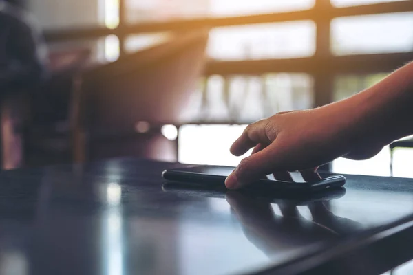 Hand Grabbing Picking Mobile Phone Table — Stock Photo, Image