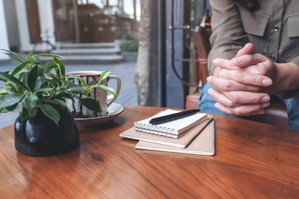 Woman Holding Her Hands While Sitting House Notebooks Pen Coffee — Stock Photo, Image