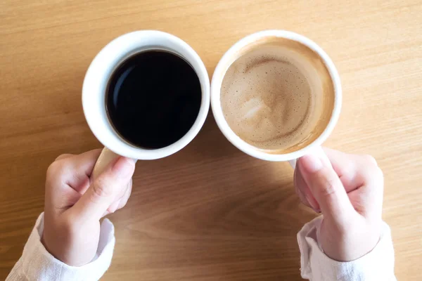 Top View Image Hands Holding Two White Cups Coffee Wooden — Stock Photo, Image