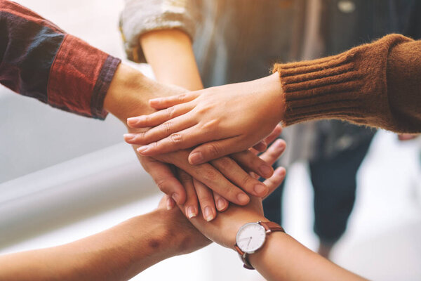 Top view image of businessman putting their hands together in the meeting