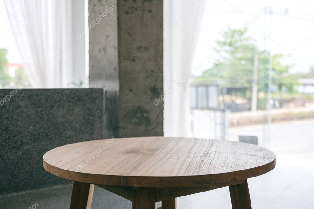 Closeup image of a wooden table in minimalist house